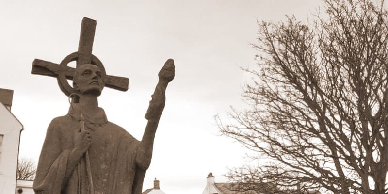 statue of Saint Aidan of Lindisfarne outside Lindisfarne Priory.